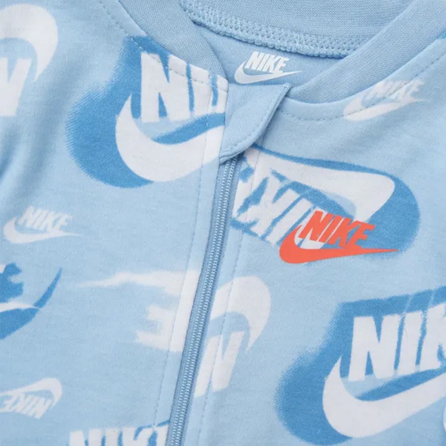 Nike NKB B NSW OTM AOP Footed Coverall in Psychic Blue with full-length zipper and footed design.